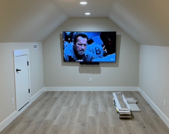 Wall-mounted TV in an empty room