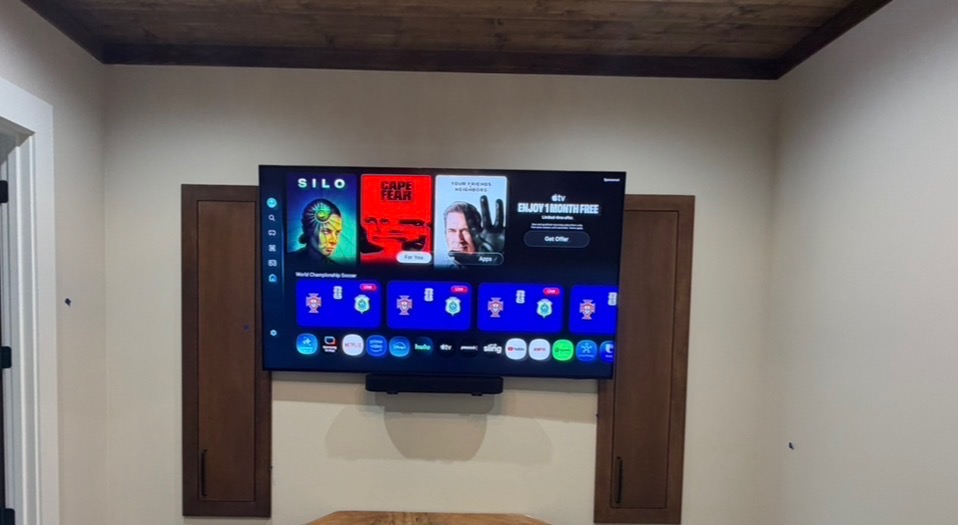 Wall-mounted TV between two cabinets