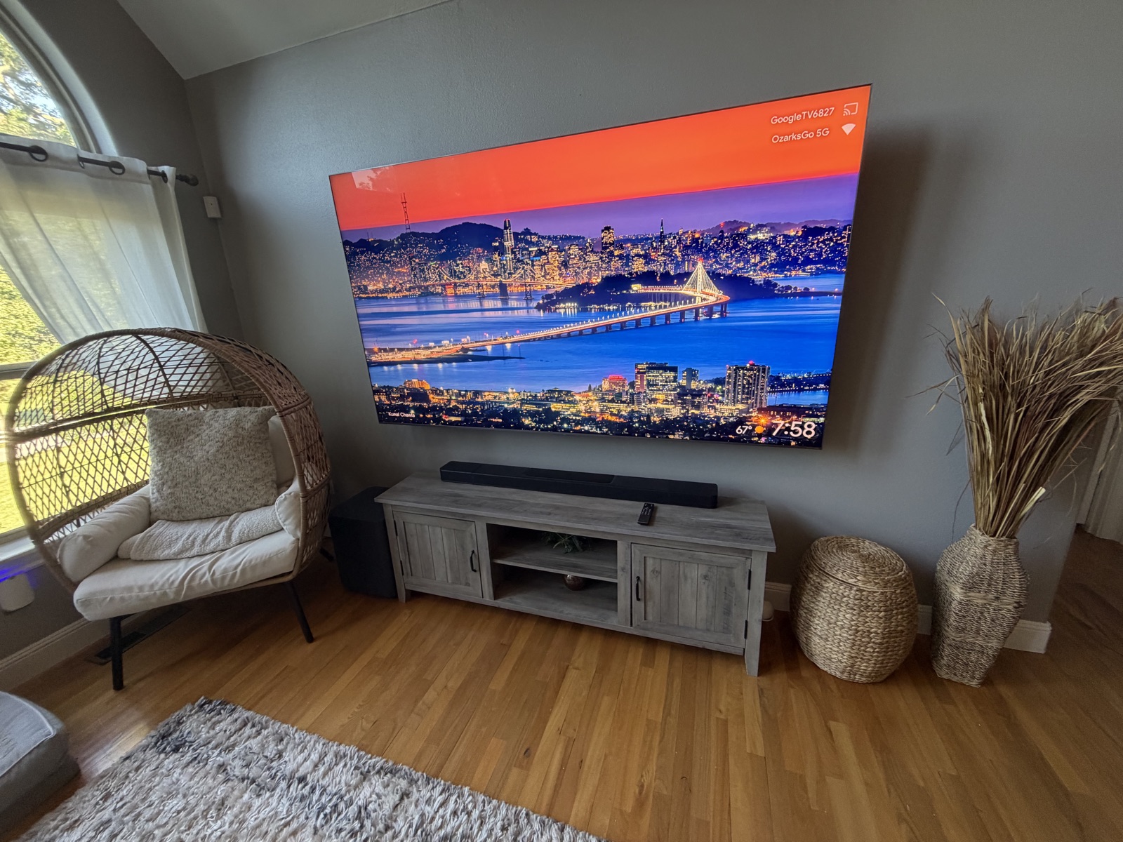 Large wall-mounted TV displaying a colorful image