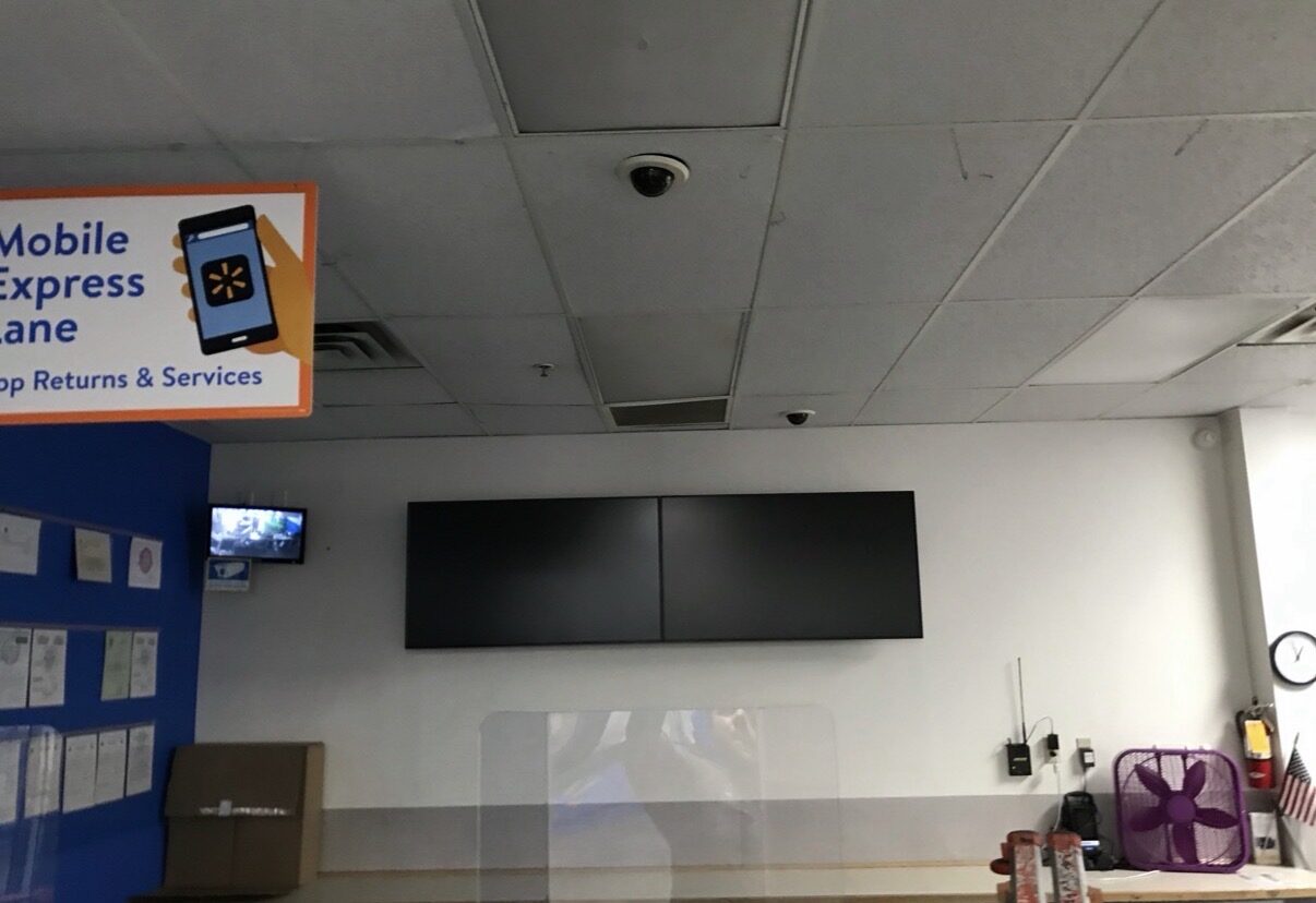Two TVs mounted side-by-side
